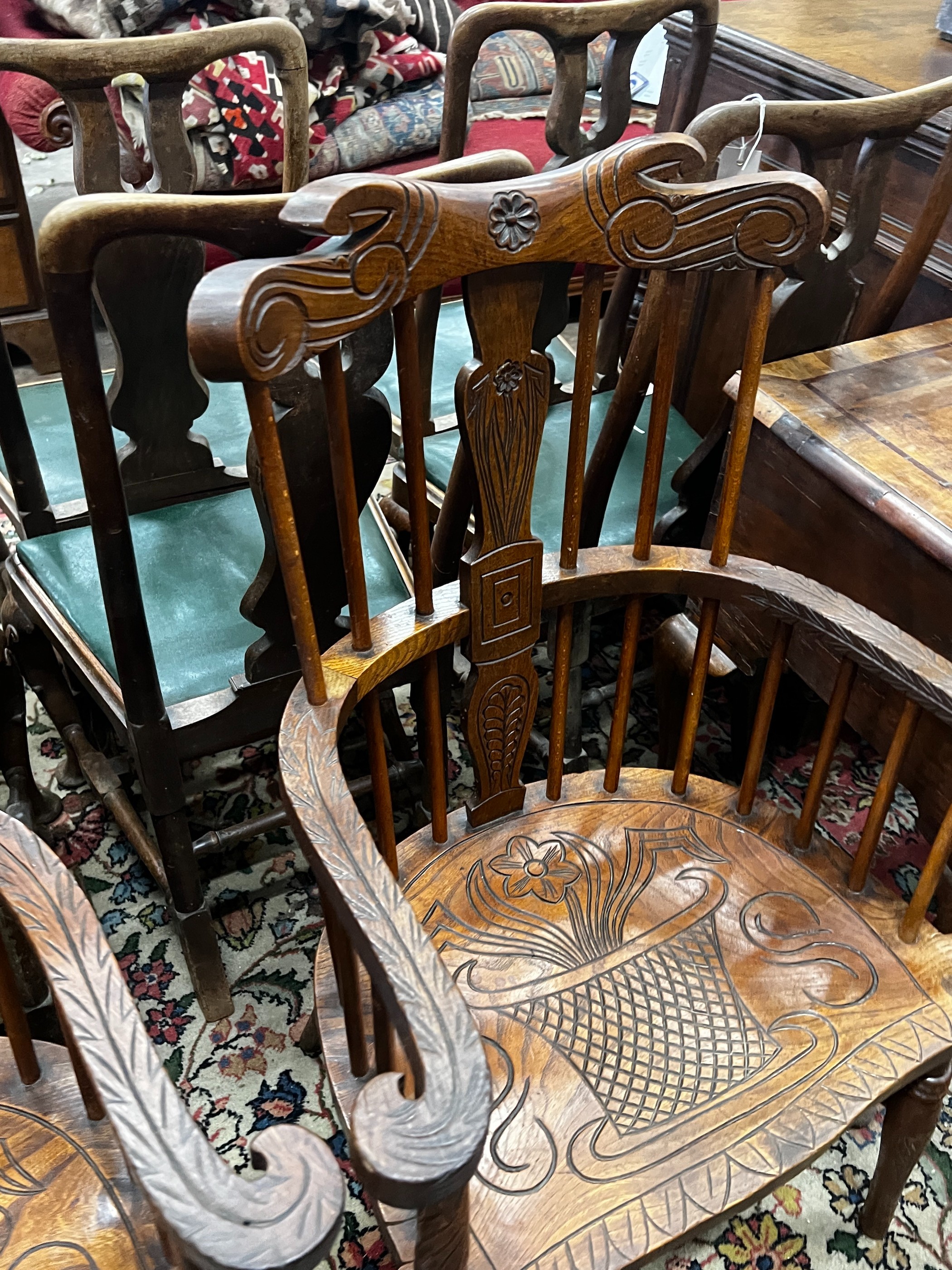 A pair of carved elm Windsor armchairs, width 69cm, depth 45cm, height 107cm